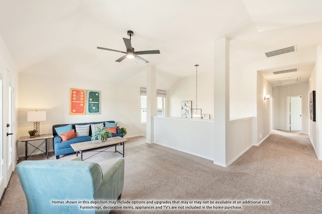 living room featuring carpet floors, lofted ceiling, and ceiling fan