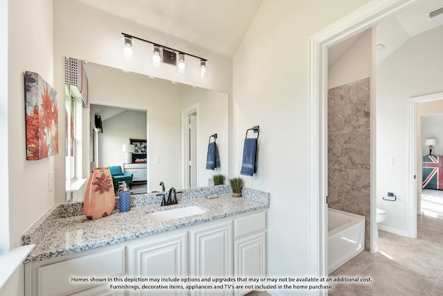 bathroom with vaulted ceiling, vanity, tile patterned floors, and toilet