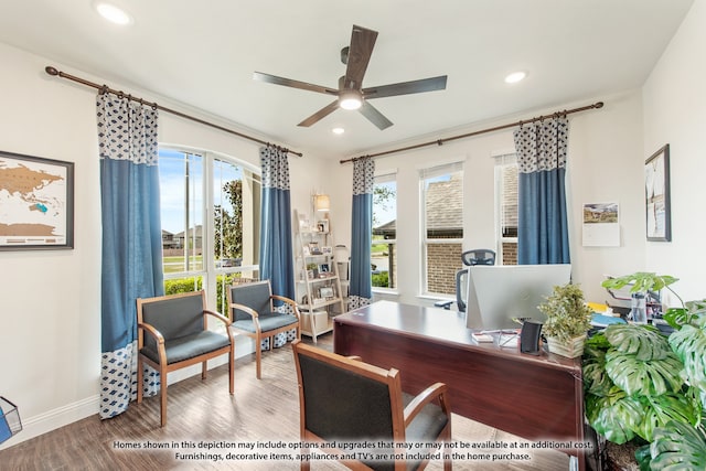 home office with ceiling fan and hardwood / wood-style floors