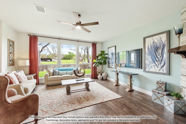 living room with dark wood-type flooring and ceiling fan