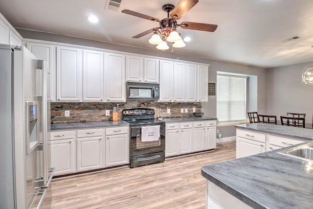 kitchen featuring ceiling fan, light hardwood / wood-style flooring, black appliances, and white cabinets