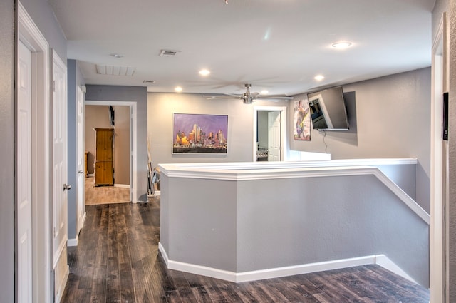 hallway with dark hardwood / wood-style flooring