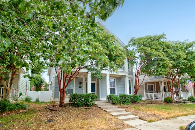 view of front of house featuring a porch and a balcony