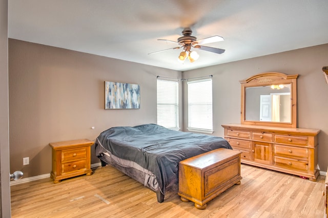 bedroom featuring light wood-type flooring and ceiling fan