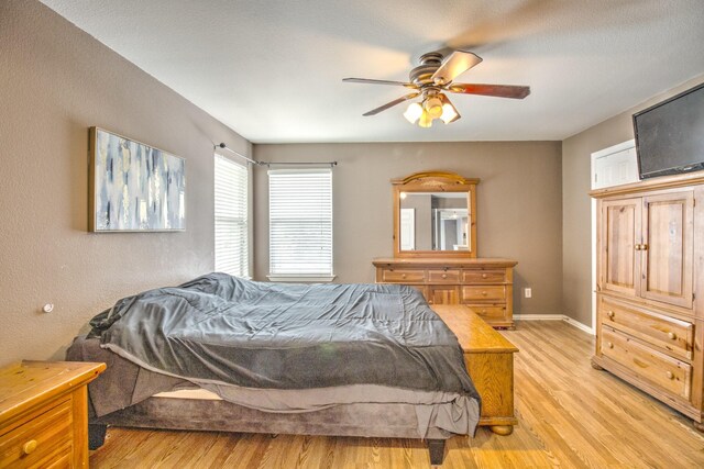 bedroom featuring ceiling fan and light wood-type flooring