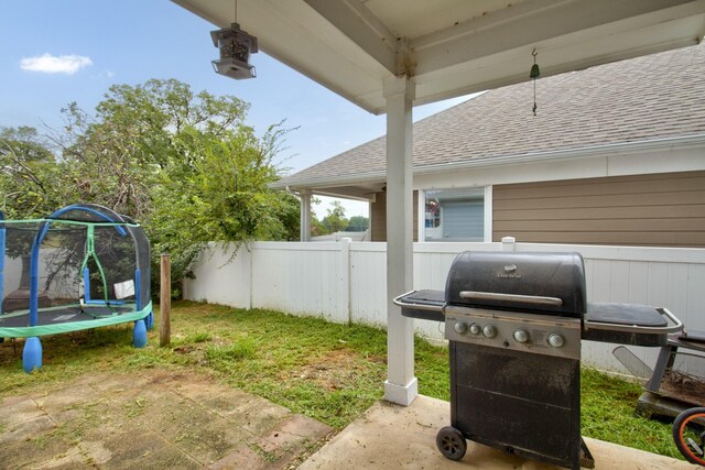 view of yard with a trampoline