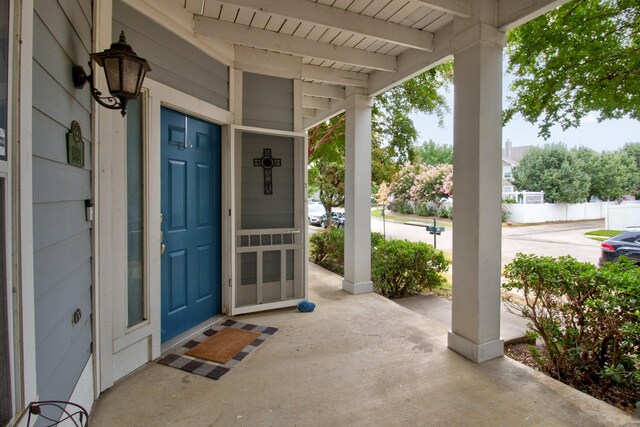 doorway to property featuring a porch