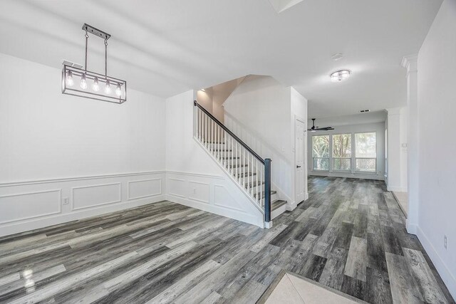 interior space with ceiling fan and hardwood / wood-style flooring