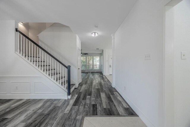 hallway with hardwood / wood-style floors