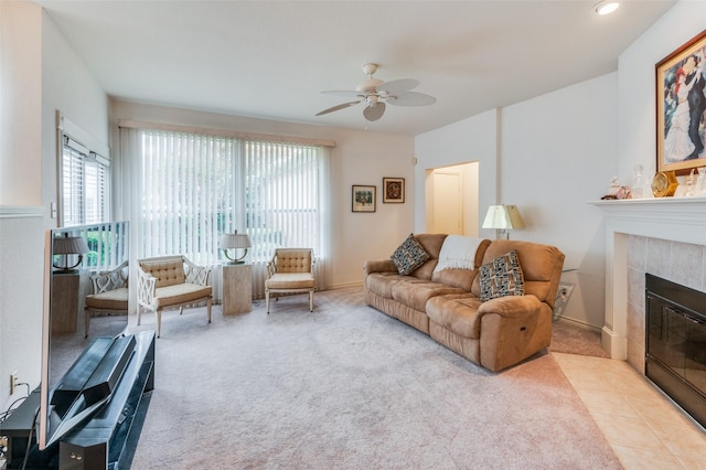 living room featuring a fireplace, a wealth of natural light, and light colored carpet