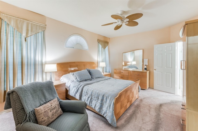 bedroom featuring ceiling fan and light colored carpet