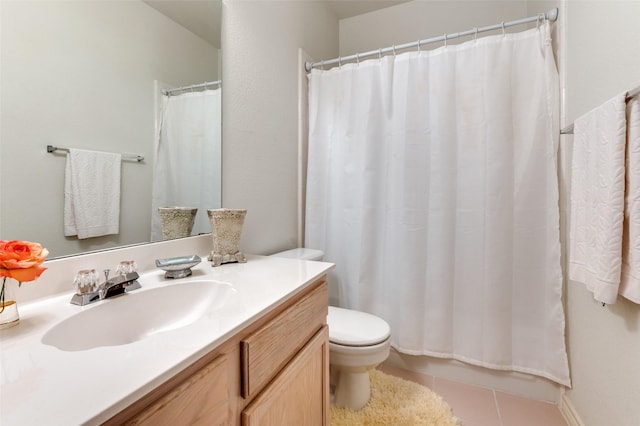 bathroom with tile patterned floors, toilet, and vanity