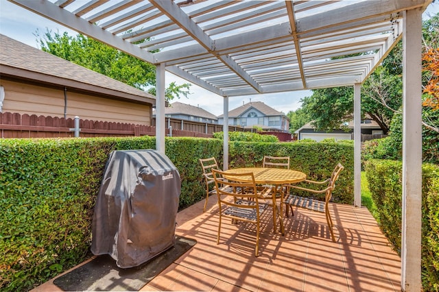 view of patio featuring grilling area and a pergola