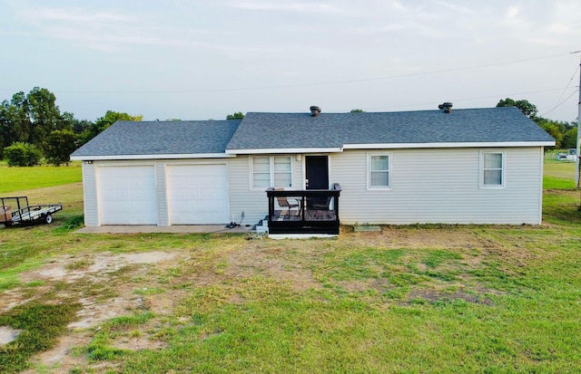 rear view of house with a yard