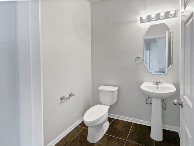 bathroom featuring tile patterned flooring and toilet