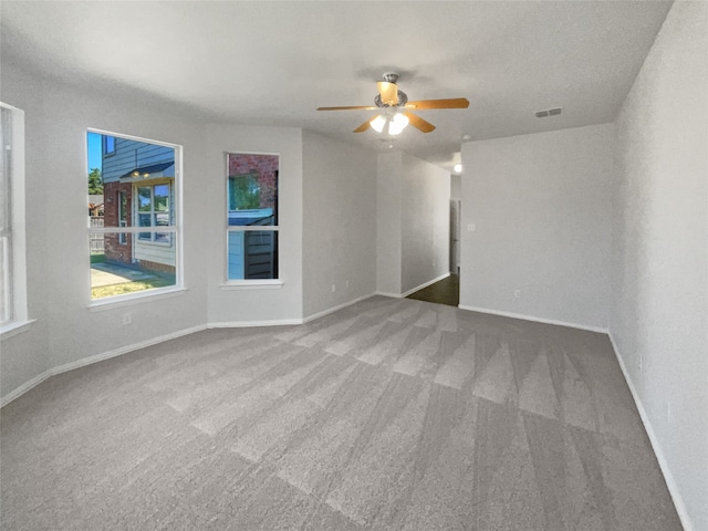 carpeted empty room with ceiling fan