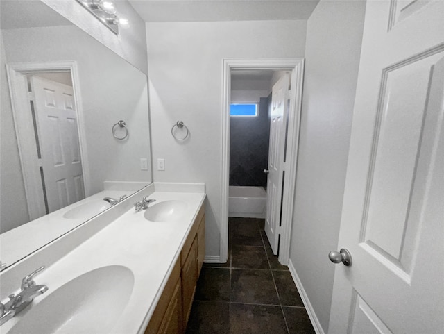 bathroom featuring tile patterned flooring, shower / bathing tub combination, and dual bowl vanity