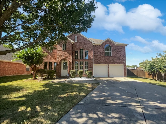 view of front of home featuring a garage and a front yard