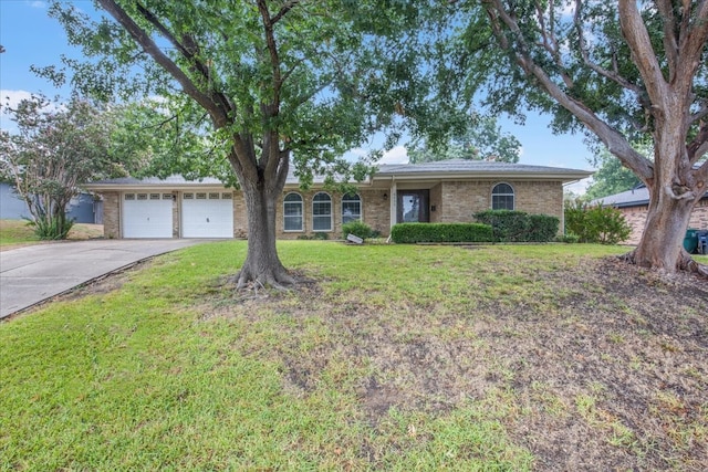 single story home featuring a garage and a front lawn