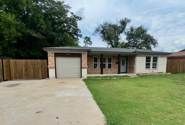 single story home featuring a garage and a front lawn