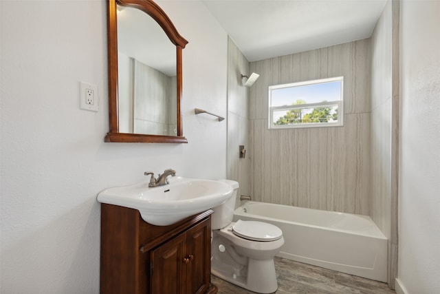 full bathroom featuring vanity, toilet, wood-type flooring, and bathtub / shower combination