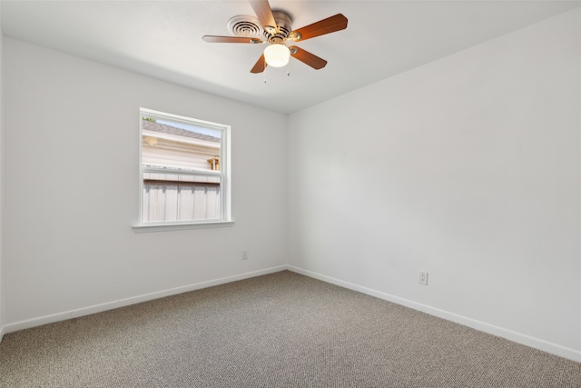 unfurnished room featuring carpet and ceiling fan