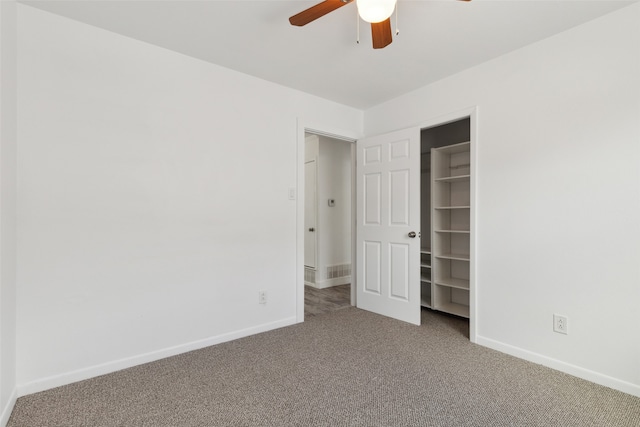 unfurnished bedroom with ceiling fan, a closet, and carpet