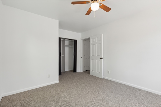 unfurnished bedroom featuring carpet floors, a closet, and ceiling fan