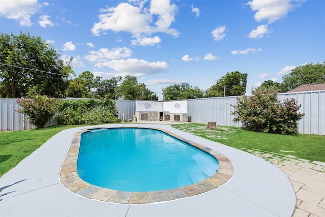 view of swimming pool featuring a patio and a lawn