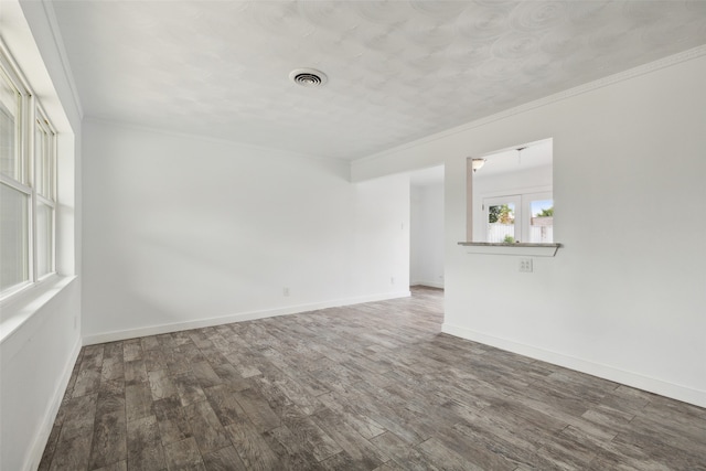 unfurnished room featuring french doors, hardwood / wood-style flooring, and ornamental molding