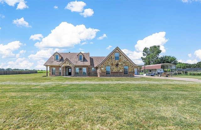 view of front of property featuring a carport and a front lawn