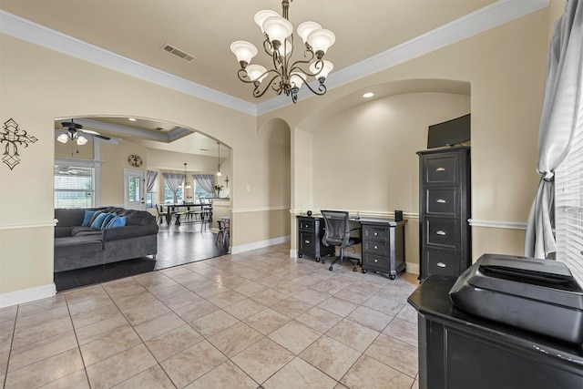 interior space with ceiling fan with notable chandelier, a raised ceiling, and crown molding