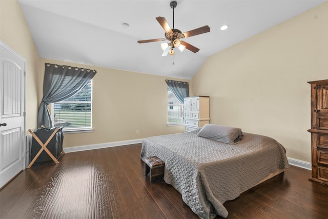 bedroom with dark wood-type flooring, ceiling fan, and vaulted ceiling