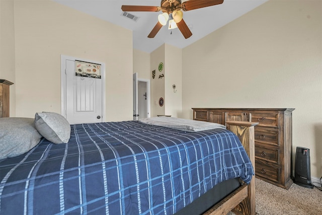 bedroom with carpet, ceiling fan, and vaulted ceiling