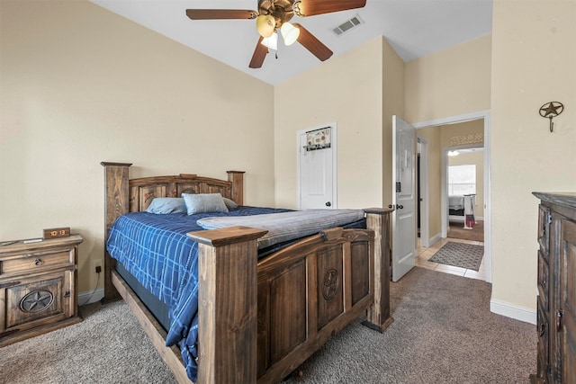 bedroom with lofted ceiling, carpet, and ceiling fan