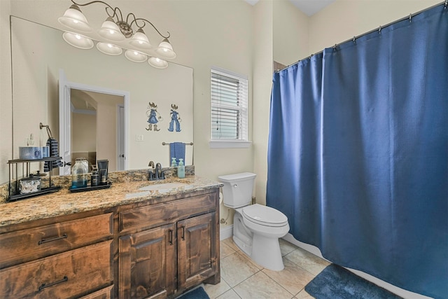 bathroom with vanity, tile patterned flooring, and toilet