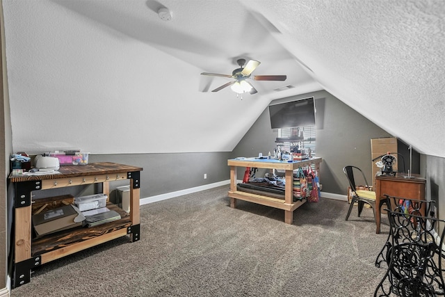 carpeted bedroom featuring ceiling fan, lofted ceiling, and a textured ceiling