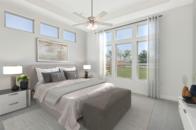 bedroom with light carpet, ceiling fan, and baseboards