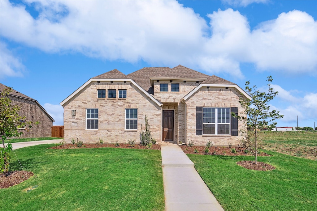 craftsman-style house with a front lawn