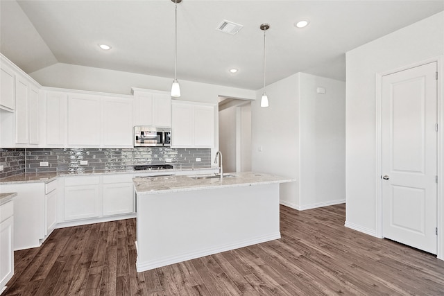 kitchen with dark hardwood / wood-style floors, sink, stainless steel appliances, and white cabinets