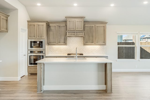 2800 Creekhollow Ct, Denton, TX 76226 - kitchen with appliances with stainless steel finishes, light countertops, tasteful backsplash, light wood-style floors, and recessed lighting