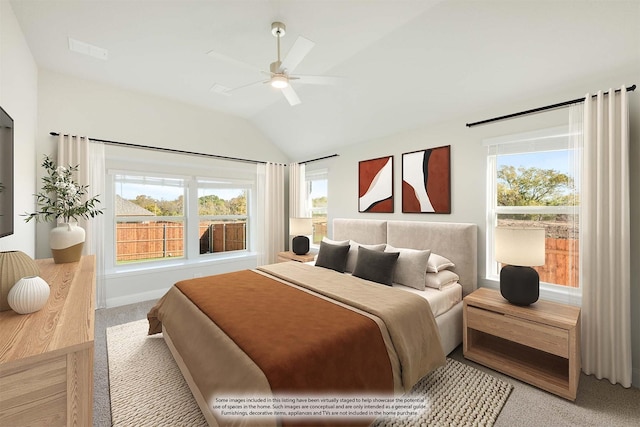 carpeted bedroom with ceiling fan and vaulted ceiling