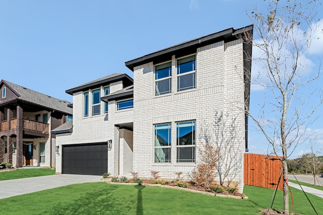 view of front of house with a balcony, a front yard, and a garage