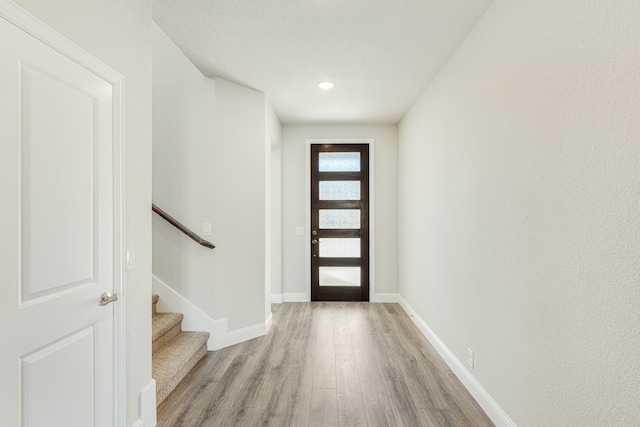 foyer with light wood-type flooring