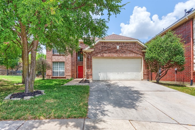 view of front property featuring a garage and a front yard