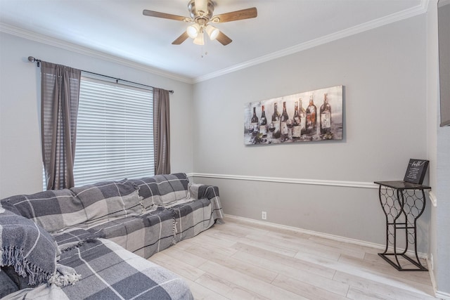 living room with ceiling fan, ornamental molding, and light hardwood / wood-style floors