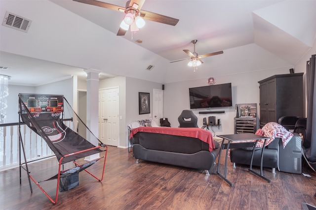 living room with dark hardwood / wood-style floors, ceiling fan, and ornate columns