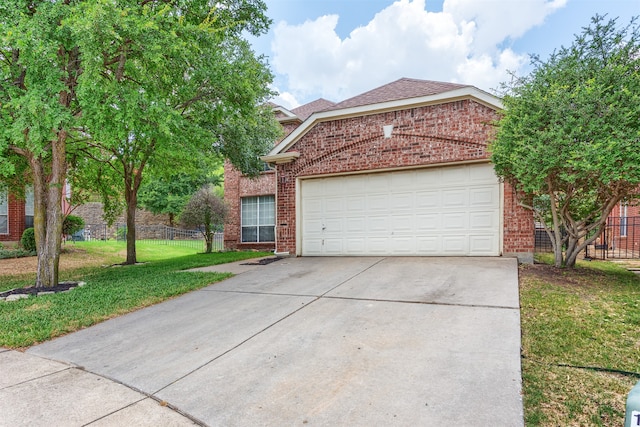 front of property with a garage and a front yard