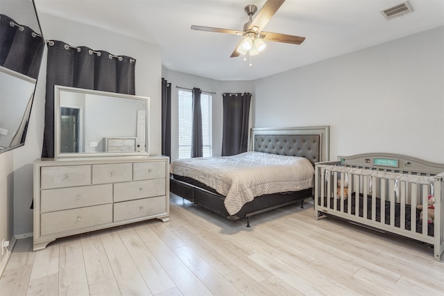 bedroom featuring light hardwood / wood-style flooring and ceiling fan