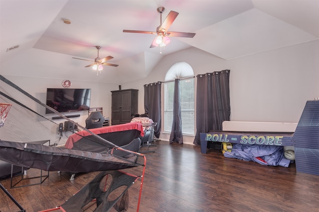 rec room featuring ceiling fan, hardwood / wood-style flooring, and vaulted ceiling